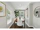 Dining room with natural light, modern art, and a view to the exterior at 960 Lindridge Ne Dr, Atlanta, GA 30324