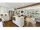 Bright, open kitchen with an island, stainless steel appliances, and a view into the living room at 960 Lindridge Ne Dr, Atlanta, GA 30324