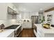 Bright kitchen featuring stainless steel appliances, a large island, and white cabinetry at 960 Lindridge Ne Dr, Atlanta, GA 30324