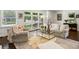 Cozy living room featuring ample natural light, comfortable seating, and stylish decor at 960 Lindridge Ne Dr, Atlanta, GA 30324