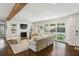 Inviting living room with a fireplace, built-in shelving, and large windows at 960 Lindridge Ne Dr, Atlanta, GA 30324