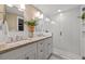 Bright bathroom featuring double vanity with granite countertop and glass enclosed tiled shower at 97 Peachtree Hills Ne Ave, Atlanta, GA 30305