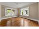 Spacious bedroom with gleaming hardwood floors and bright windows at 97 Peachtree Hills Ne Ave, Atlanta, GA 30305