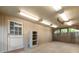 Spacious garage with white door, plenty of lighting and open space at 97 Peachtree Hills Ne Ave, Atlanta, GA 30305