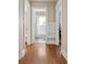 Hallway featuring hardwood floors and a view into a bright bathroom at 97 Peachtree Hills Ne Ave, Atlanta, GA 30305