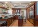 Gourmet kitchen with custom cherry cabinets, stainless steel appliances, and eat-in island at 97 Peachtree Hills Ne Ave, Atlanta, GA 30305