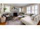 Comfortable living room showcasing hardwood floors, a fireplace, and bright windows at 97 Peachtree Hills Ne Ave, Atlanta, GA 30305