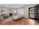 Bright living room featuring hardwood floors, a fireplace, and plenty of natural light at 97 Peachtree Hills Ne Ave, Atlanta, GA 30305
