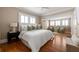 Spacious main bedroom with sitting area, large windows, and hardwood floors at 97 Peachtree Hills Ne Ave, Atlanta, GA 30305