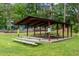 Picnic area with covered tables and benches at 97 Peachtree Hills Ne Ave, Atlanta, GA 30305