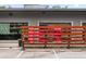 Outside the restaurant, behind a fence with the restaurant's red logo at 97 Peachtree Hills Ne Ave, Atlanta, GA 30305