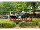 The Houston's sign is surrounded by greenery at 97 Peachtree Hills Ne Ave, Atlanta, GA 30305