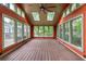 Sunroom featuring a ceiling fan, skylights, and views of the surrounding greenery at 97 Peachtree Hills Ne Ave, Atlanta, GA 30305