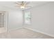 Bedroom with neutral carpet, ceiling fan, and a window at 205 Kindness Cir, Mcdonough, GA 30252