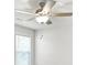 Modern ceiling fan with light fixture over a window with horizontal blinds in a minimalist room at 205 Kindness Cir, Mcdonough, GA 30252
