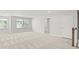 Loft with large windows and neutral carpet near the staircase at 205 Kindness Cir, Mcdonough, GA 30252