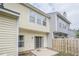 Exterior of home showcasing a backyard patio and siding, offering a charming outdoor space at 3746 Berkeley Xing, Duluth, GA 30096