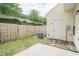 Fenced backyard featuring a patio, lawn, storage, and A/C unit for outdoor comfort and convenience at 3746 Berkeley Xing, Duluth, GA 30096