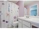A full bathroom featuring a shower-tub combo and a white vanity at 3746 Berkeley Xing, Duluth, GA 30096