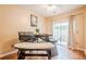 Bright dining room with modern table set and sliding glass doors leading to the outdoor space at 3746 Berkeley Xing, Duluth, GA 30096