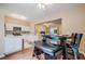 Well-appointed kitchen featuring stainless steel appliances, white cabinets, and an adjacent dining area at 3746 Berkeley Xing, Duluth, GA 30096