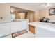 Open kitchen with view to the dining area and open staircase at 3746 Berkeley Xing, Duluth, GA 30096