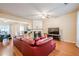 Cozy living room with hardwood floors, fireplace, modern furniture, and a flat screen television at 3746 Berkeley Xing, Duluth, GA 30096