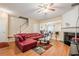 Comfortable living room featuring hardwood floors, a fireplace, and an open concept design at 3746 Berkeley Xing, Duluth, GA 30096