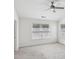 Bright bedroom with two windows that provide ample natural light, ceiling fan, and plush carpeting at 6080 Indian Wood Se Cir, Mableton, GA 30126