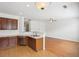Bright kitchen with stainless steel appliances, dark wood cabinets, and a breakfast bar overlooking the spacious living area at 6080 Indian Wood Se Cir, Mableton, GA 30126