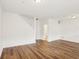 Open living room featuring wood floors and stairwell access at 6080 Indian Wood Se Cir, Mableton, GA 30126