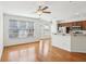 Bright open living area with hardwood floors, a ceiling fan, and views of the kitchen, creating an inviting space at 6080 Indian Wood Se Cir, Mableton, GA 30126