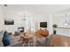 Bright, open living room with hardwood floors, a fireplace, and modern furnishings, creating a cozy and inviting space at 6080 Indian Wood Se Cir, Mableton, GA 30126