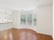 Open living room featuring hardwood floors, natural light, and iron railing at 6080 Indian Wood Se Cir, Mableton, GA 30126