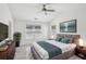 Comfortable main bedroom with vaulted ceiling, a ceiling fan, and a large bed, creating a relaxing retreat at 6080 Indian Wood Se Cir, Mableton, GA 30126
