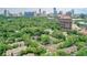 Stunning aerial view showcasing the townhouse community nestled among lush greenery with the city skyline in the background at 70 Old Ivy Ne Rd # 29, Atlanta, GA 30342