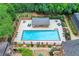 Aerial view of the beautiful community pool surrounded by lush greenery and lounge chairs at 70 Old Ivy Ne Rd # 29, Atlanta, GA 30342