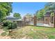 Private backyard pool enclosed by wrought iron fencing and mature trees at 70 Old Ivy Ne Rd # 29, Atlanta, GA 30342