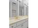 Bathroom vanity with gold faucet, bright lighting, and large mirror at 70 Old Ivy Ne Rd # 29, Atlanta, GA 30342