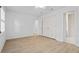 Spacious bedroom with neutral walls, hardwood floors, and closet with double doors at 70 Old Ivy Ne Rd # 29, Atlanta, GA 30342