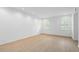 Bright bedroom with neutral walls, recessed lighting, and wood flooring and windows with shutters at 70 Old Ivy Ne Rd # 29, Atlanta, GA 30342