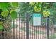 Entry to community dog park featuring secure fencing, a rules sign, and nearby pool access at 70 Old Ivy Ne Rd # 29, Atlanta, GA 30342