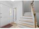 Bright foyer with wooden stairs and tiled floor at 70 Old Ivy Ne Rd # 29, Atlanta, GA 30342