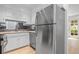 Updated kitchen featuring stainless steel refrigerator and white cabinets at 70 Old Ivy Ne Rd # 29, Atlanta, GA 30342