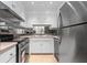 Compact kitchen with stainless steel appliances and white cabinets at 70 Old Ivy Ne Rd # 29, Atlanta, GA 30342
