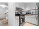 Well-lit kitchen with stainless steel appliances and easy access to staircase at 70 Old Ivy Ne Rd # 29, Atlanta, GA 30342