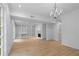 Bright living room featuring hardwood floors, a fireplace, and built-in shelving at 70 Old Ivy Ne Rd # 29, Atlanta, GA 30342