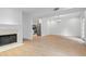 Open living room with fireplace and stainless steel kitchen appliances in the background at 70 Old Ivy Ne Rd # 29, Atlanta, GA 30342
