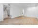 Spacious living room with light hardwood floors and staircase at 70 Old Ivy Ne Rd # 29, Atlanta, GA 30342