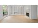 Spacious living room features built-in bookshelves, a fireplace, and French doors to the outdoors at 70 Old Ivy Ne Rd # 29, Atlanta, GA 30342